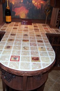 Tumbled marble wine labels on countertop in wine cellar