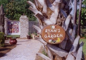 Memorial to her son ...collage artwork transferred onto tiles for an outdoor Wall